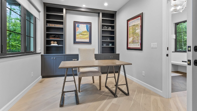 Small home office with newly built cabinets and a small desk