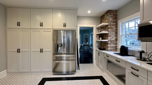 White kitchen showing dining room entrance