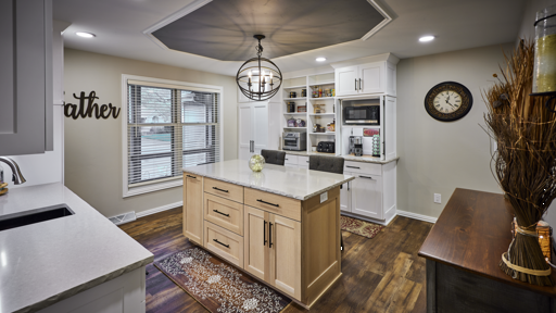 View of kitchen showing island and circular light fixture