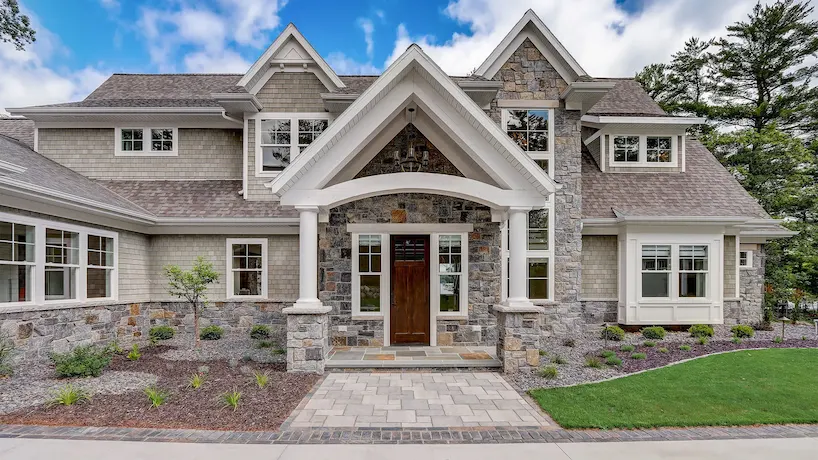 entryway to a beautiful Wisconsin home featuring heat-absorbing stone construction and weatherproof windows